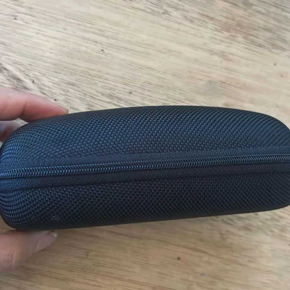 Revo hard sunglass zip around case. Black fleece lining